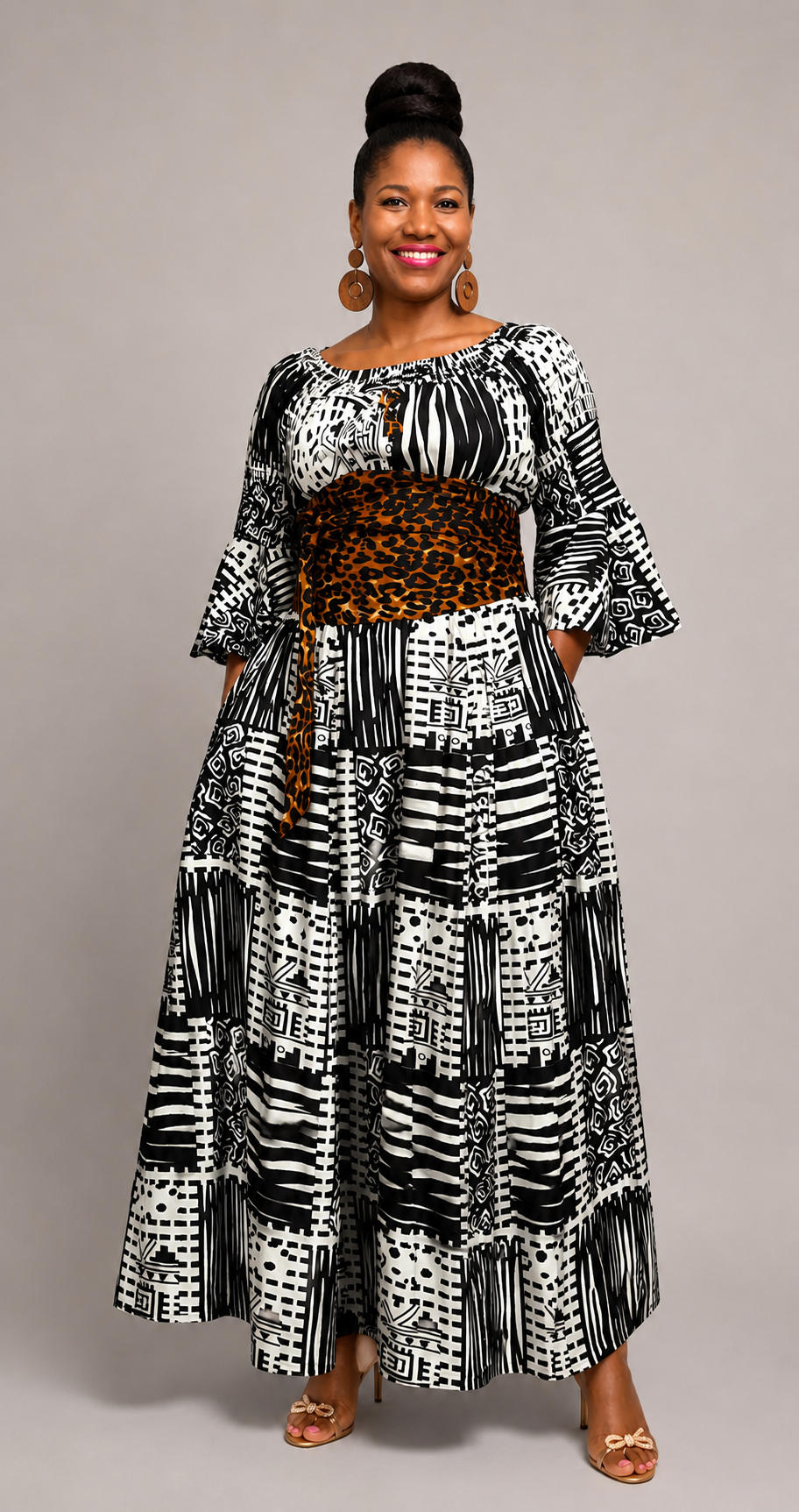 Leopard sash belt paired with a black and white printed maxi dress